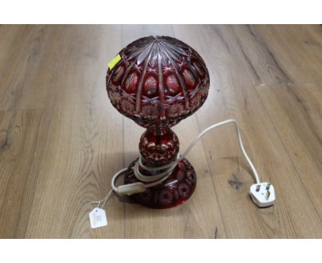 Red glass overlaid decorative table lamp with glass shade, height approx 35 cm