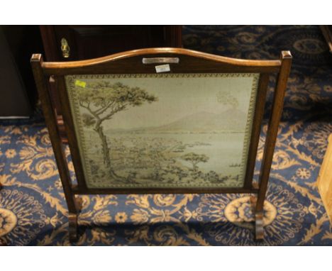 Oak tapestry fire screen with glazed harbour scene section to centre 