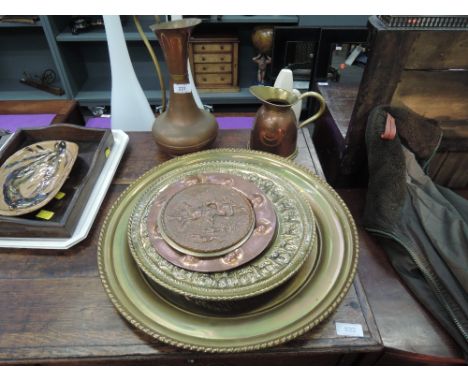 A selection of vintage brass and copper wares including hunting plaques