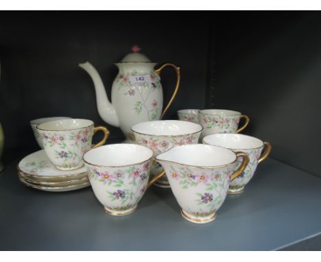 A part tea service by Delphine with hand decorated floral work 15 pieces approx