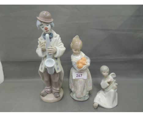 Two lladro studies, Sad Sax 5471 & girl with oranges and a similar study, Angel