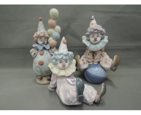Three Lladro figures, Having a Ball 5813, Tired Friend 5812 & Littlest Clown 5811