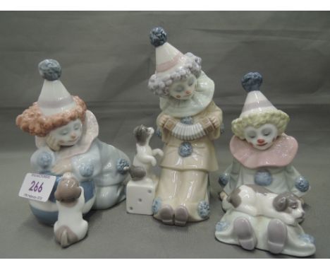 Three Lladro figures, Clowns with puppies