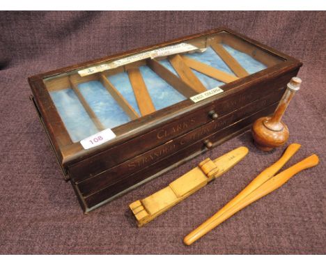 A collection of vintage glove fitting tools, including stretchers, Clarks Anchor cotton display drawer etc