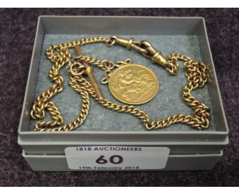 A yellow metal curb link watch chain stamped 9ct with bar and mounted half sovereign dated 1911. 18.7g 