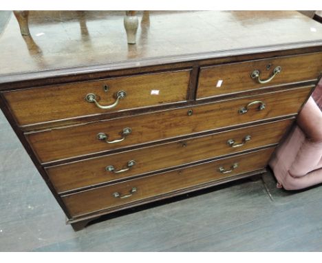 An early 19th Century George III mahogany chest of 2 short and 3 long cockbeaded drawers on bracket feet