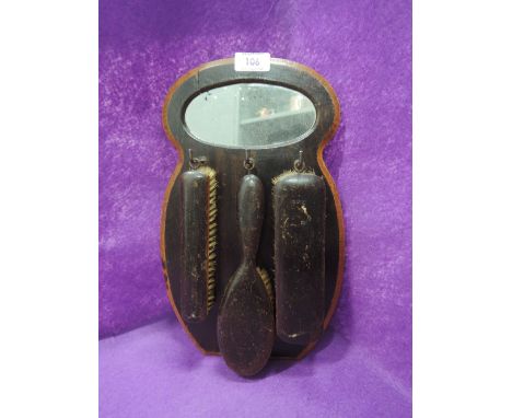 A set of vintage shoe shine brushes with mirror rack