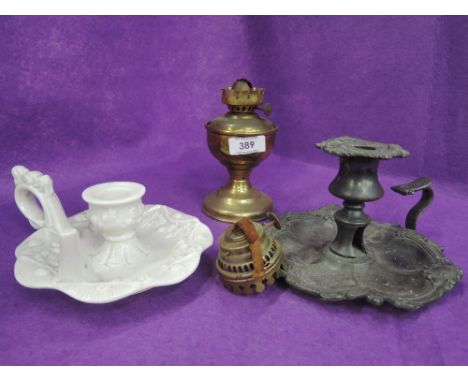 A selection of vintage candle stick holders pewter and white pressed glass