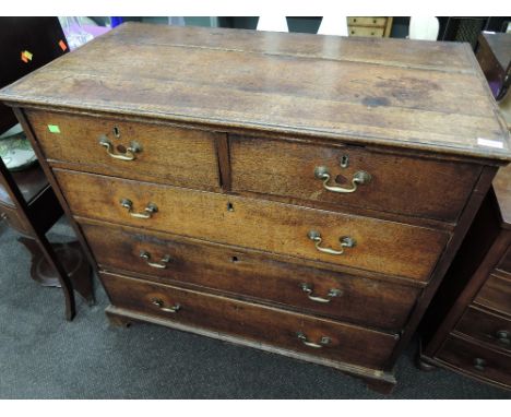 A late 18th Century oak chest of 2 short and 3 long drawers on bracket and plinth base