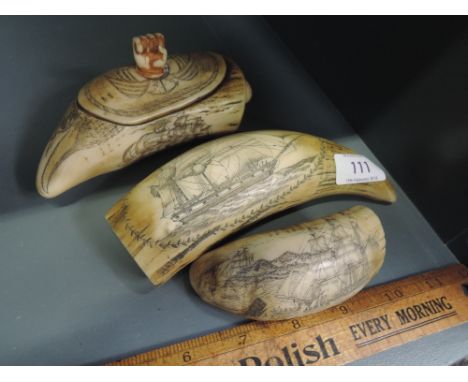 A selection of vintage style scrimshaw carvings possibly resin cast