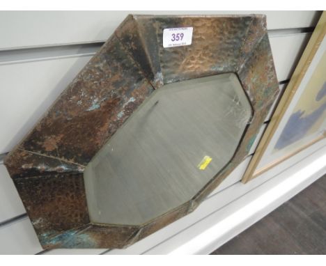A vintage arts and crafts style mirror hexagonal with bevel glass and metal frame