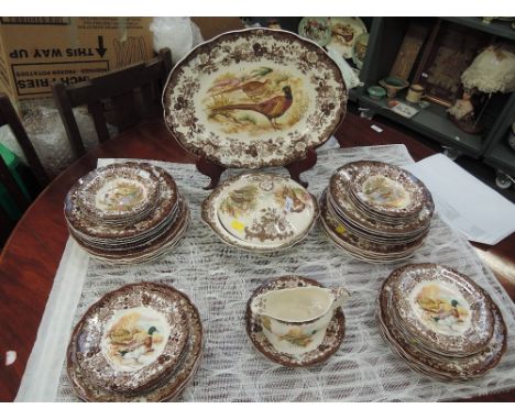 A vintage dinner service by Royal Worcester group in the Game Series Pattern 50 pieces approx