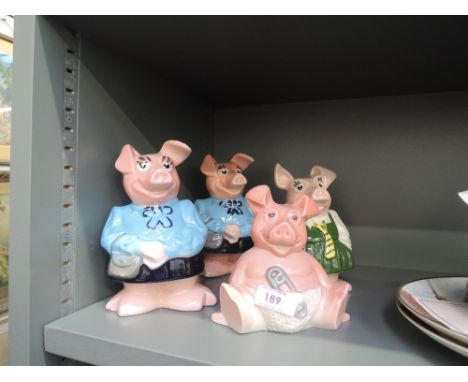A selection of vintage ceramic piggy banks by Nat West