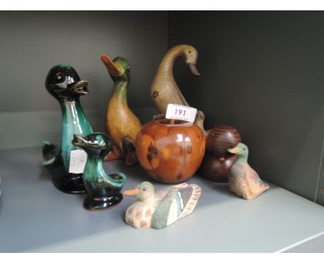 A selection of decorative objects including ceramic ducks and treen carved fruit