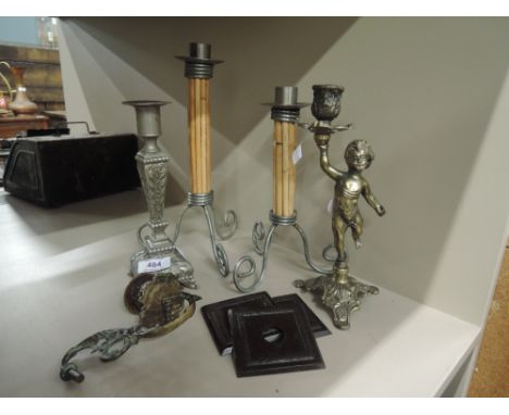 A selection of various candle sticks including brass cast Cherub stick