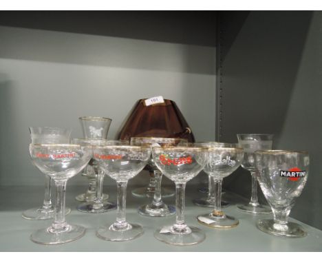 A selection of vintage advertising cocktail glasses including Babycham