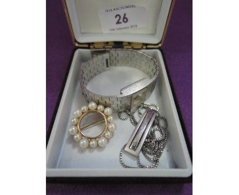 Three pieces of costume jewellery including a Monet pearl wreath brooch, Tissot wrist watch and a silver pendant with diamond