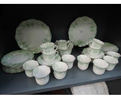A vintage dinner srvice un marked in an Italian style with green transfer print