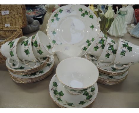 A vintage tea service by Colclough with ivy transfer and gilt edge trim
