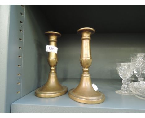 A pair of vintage brass cast candle sticks