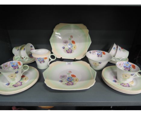 A Shelley six piece tea service in floral pattern on green ground, Reg No 756533