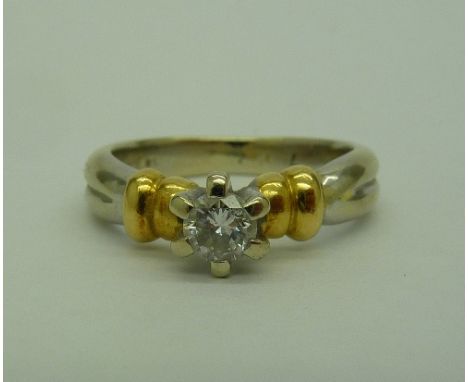 An 18ct, two colour gold solitaire diamond ring, weight 5.7g, size M