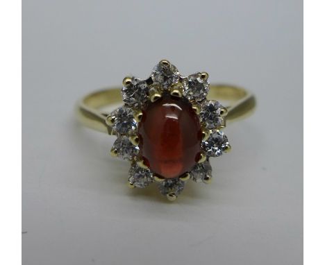 A 9ct gold, red and white stone cluster ring, weight 2.9g, size M