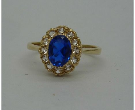 A 9ct gold, blue and white stone cluster ring, weight 2.3g, size M