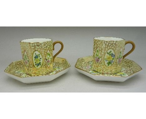 A pair of octagonal Wedgwood cups and saucers, decorated by M. Ramsay, 1964