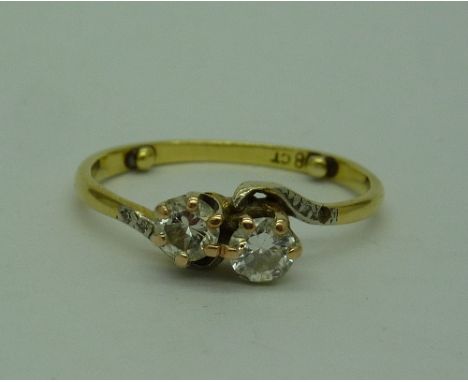 An 18ct gold and two white stone ring, weight 2.5g, size M