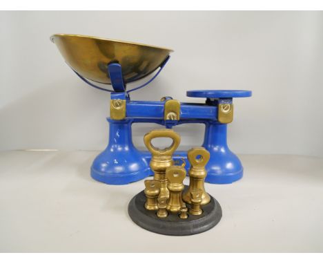 A Thornton and Co set of cast iron kitchen scales with weights 