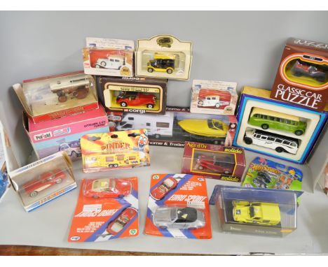 A collection of die-cast cars, Corgi, Pinder, Polosil, Matchbox, Dinky, Teamsters and Burago, boxed