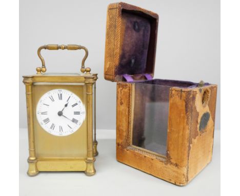 A 19th Century gilt brass carriage clock with key in a fitted travel case 