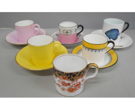 Three Shelley coffee cans and saucers including one with fish detail, Rowland Ward, Nairobi, Kenya, two Royal Doulton coffee 