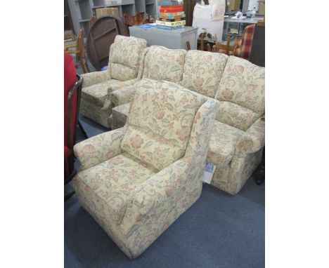 A three seater sofa and two armchairs