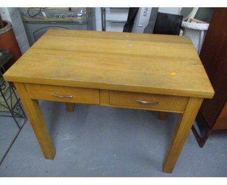 A modern light oak, two drawer desk on square legs, 31 1/2 h x 39 1/4 w