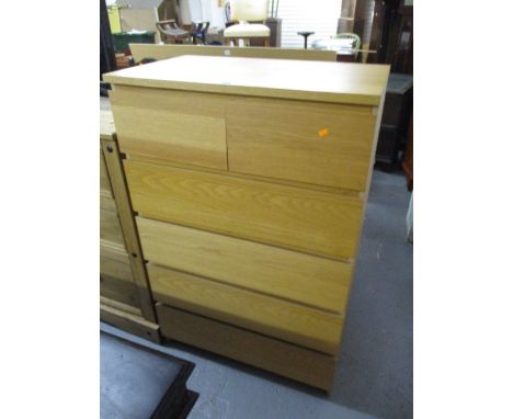 A light oak chest of two short and four long drawers, 49 x 32 x 19