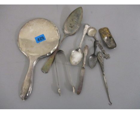 Mixed silver and silver plated cutlery to include spoons, sugar tongs, a caddy spoon, a hand mirror, a button hook and other 