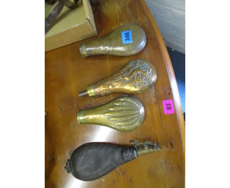A 19th century A.M. Flask and Cap Co leather powder flask, and three 19th century copper powder flasks