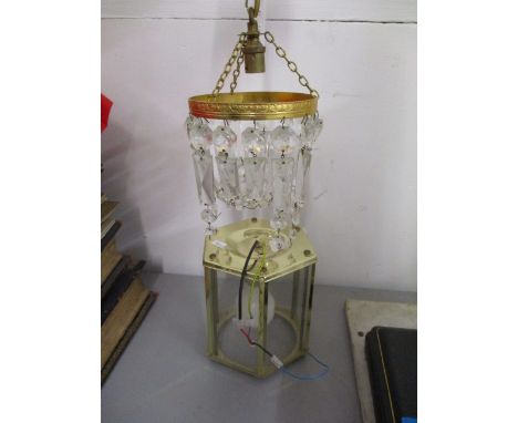 A crystal hanging light fitting with another light fitting