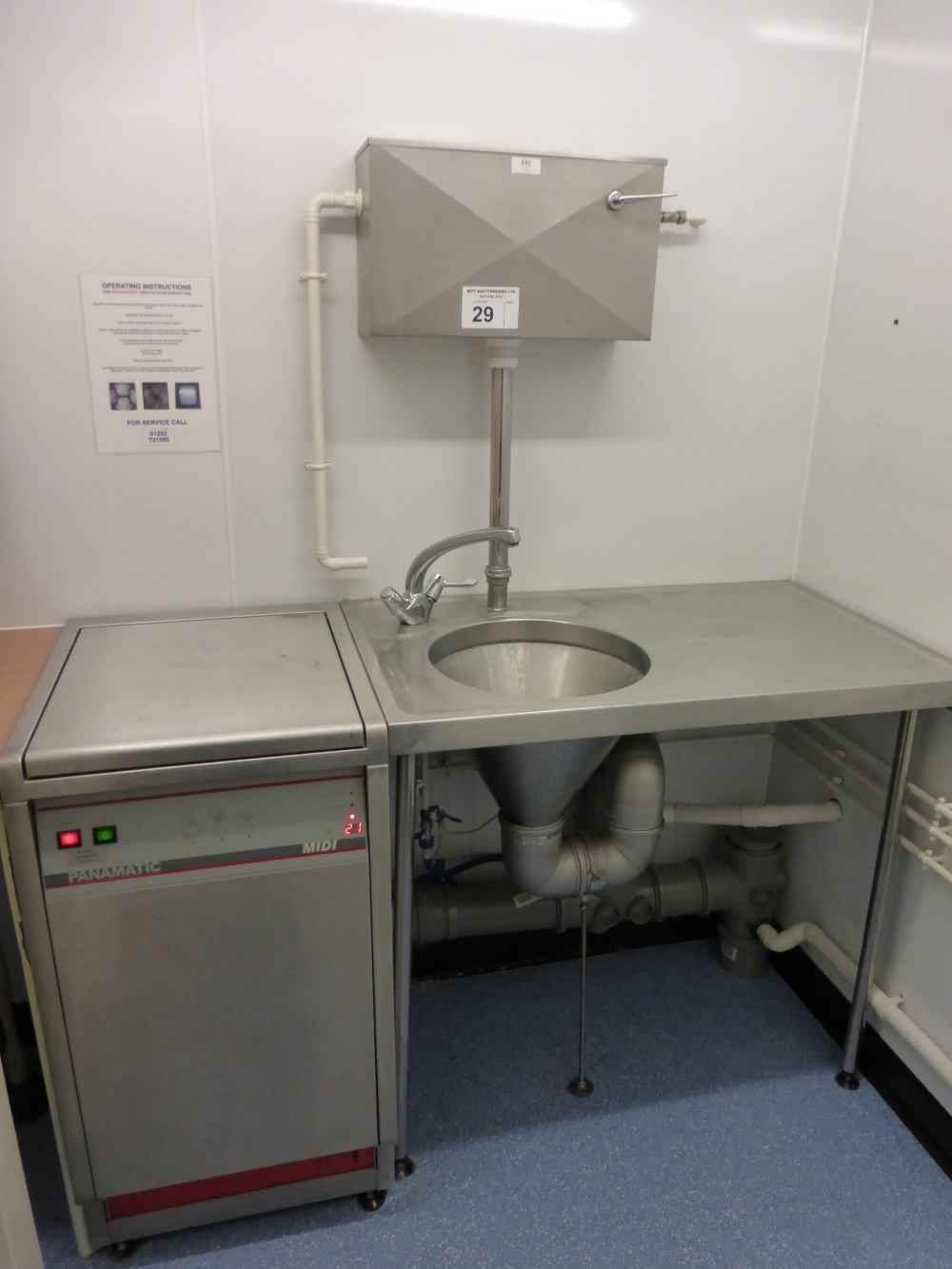 A Panamatic Midi stainless steel sluicer disinfector with a stainless