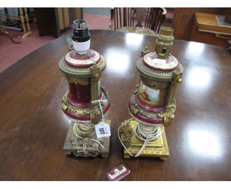 A Pair of Late XIX Century Clock Ornaments, the porcelain bodies decorated with figures representing music and painting, with