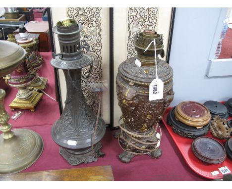 A Lempereur &amp; Bernard Late XIX Century Bronzed Metal Oil Lamp, with allover foliate decoration and mask handles, another 