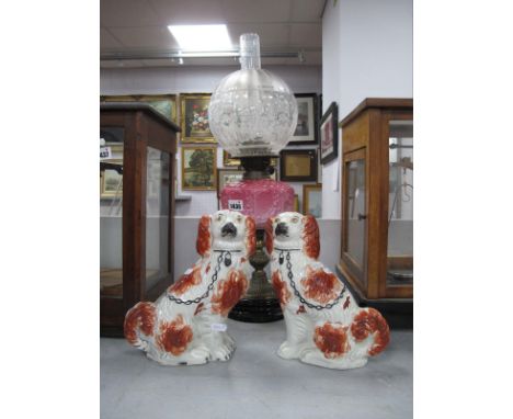 A Pair of XIX Century Staffordshire Dogs, together with a XIX Century oil lamp.