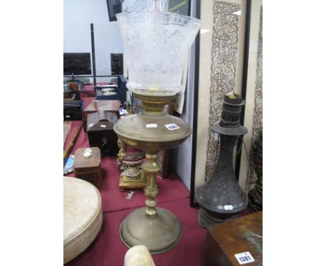 Early XX Century Brass Oil Lamp, with circular base and wavy glass shade.