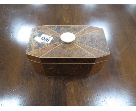 An XVIII Style Tea Caddy in Burr Walnut, and other woods, box wood stringing, twin compartments, octagonal form 19.5cm wide.