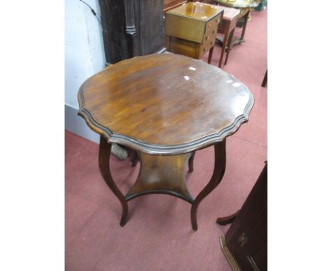 An Early XX Century Mahogany Window Table, with shaped top, cabriole legs, with under shelf.