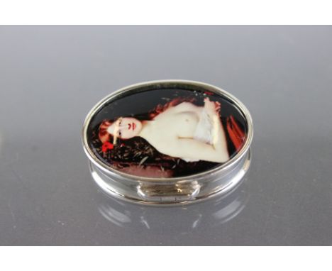 A silver pill box with nude enamel panel. 