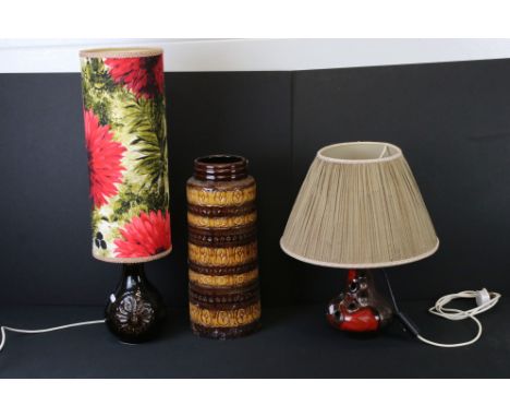 Two Retro West German ceramic lamp bases to include one fat lava lamp base of bulbous form with twin handles and needlework s