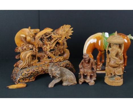 A small collection of oriental carvings together with a ceramic horse figure. 